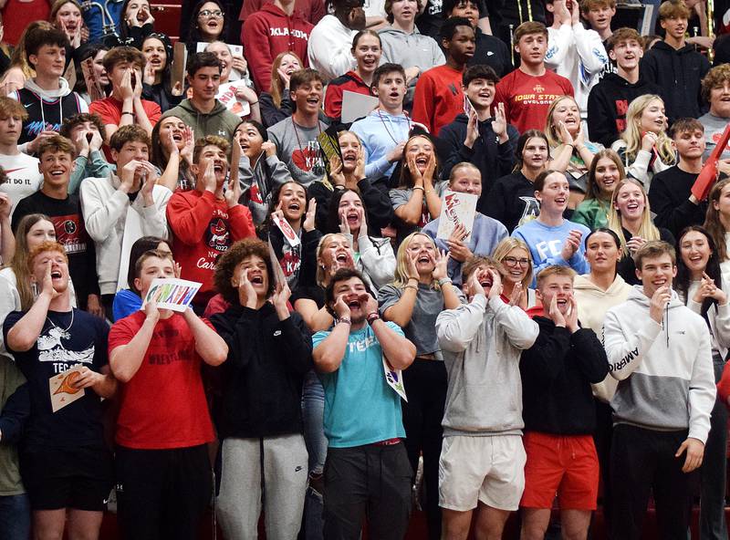 The Newton Cardinals student section cheers on their peers during The Big Game on April 19 at Newton High School.