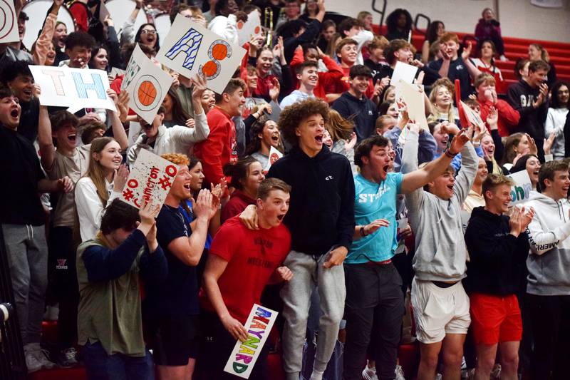 The Newton Cardinals student section cheers on their peers during The Big Game on April 19 at Newton High School.