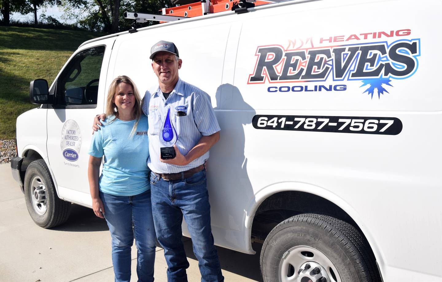 From left: Kristen Reeves and Jack Reeves of Reeves Heating & Cooling pose with company's Carrier President's Award, a prestigious honor given to the best of the best Carrier dealers.
