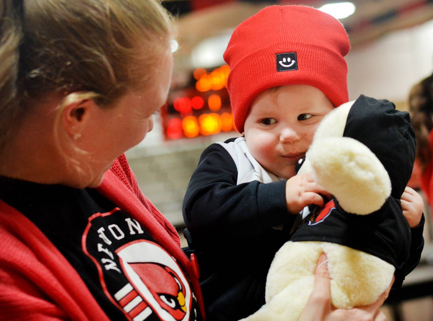 Tatum Hills, 1, clutches his newly made teddy bear during a fundraiser for the United Way of Jasper County and Newton Pacesetters on Dec. 12 at Newton High School.