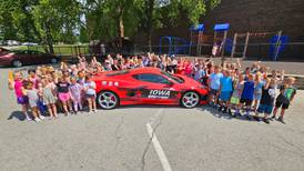 Kids enrolled in YMCA camp complete STEM activities for NASCAR field day