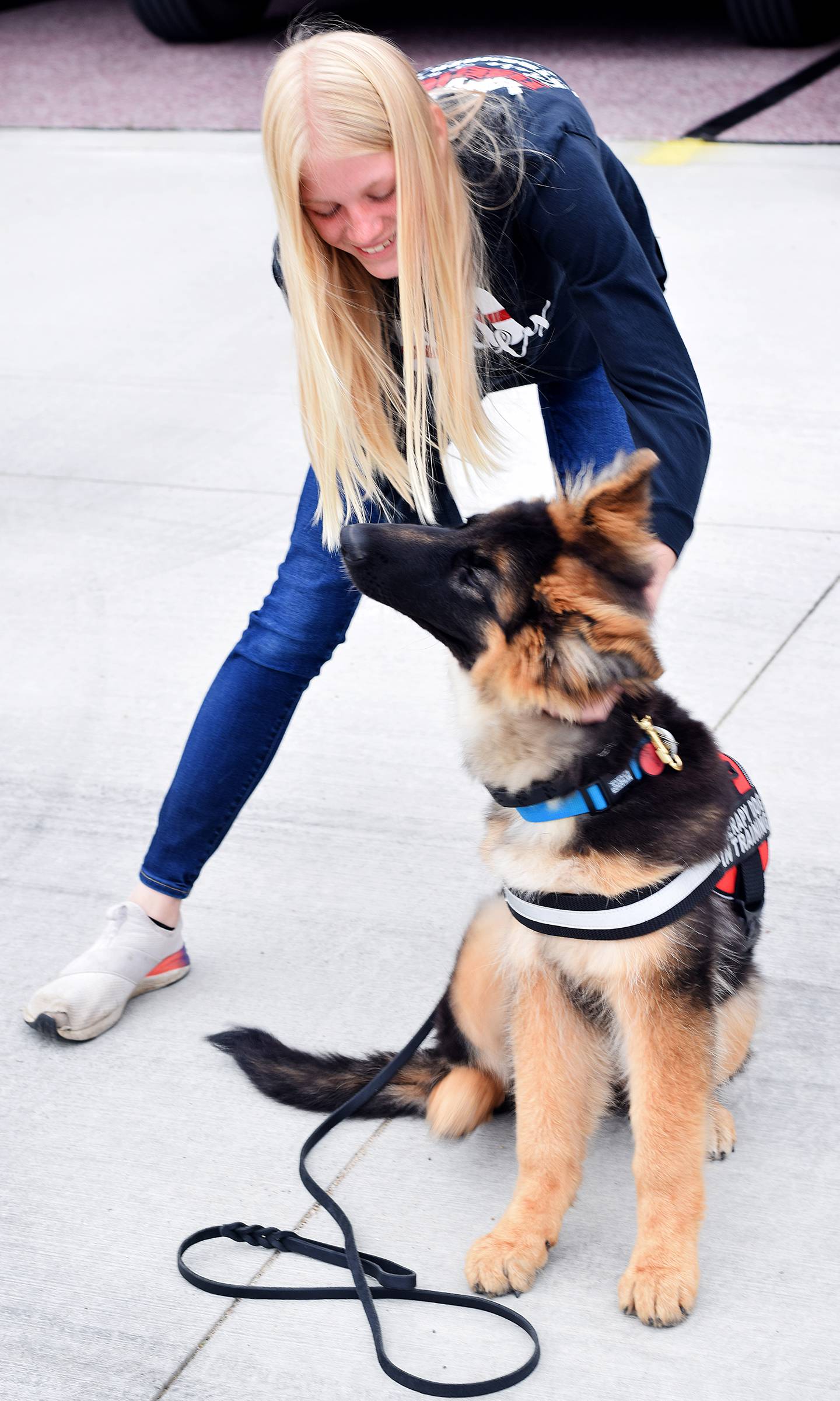 River, a four-month-old German Shepherd puppy and therapy dog in-training, gets an ear scratch that feels so good she taps her foot, leading to the Ashing family to call her 