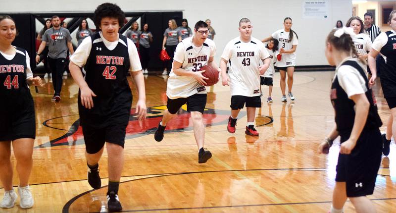 Thomas Russell hustles down the court during The Big Game on April 19 at Newton High School.