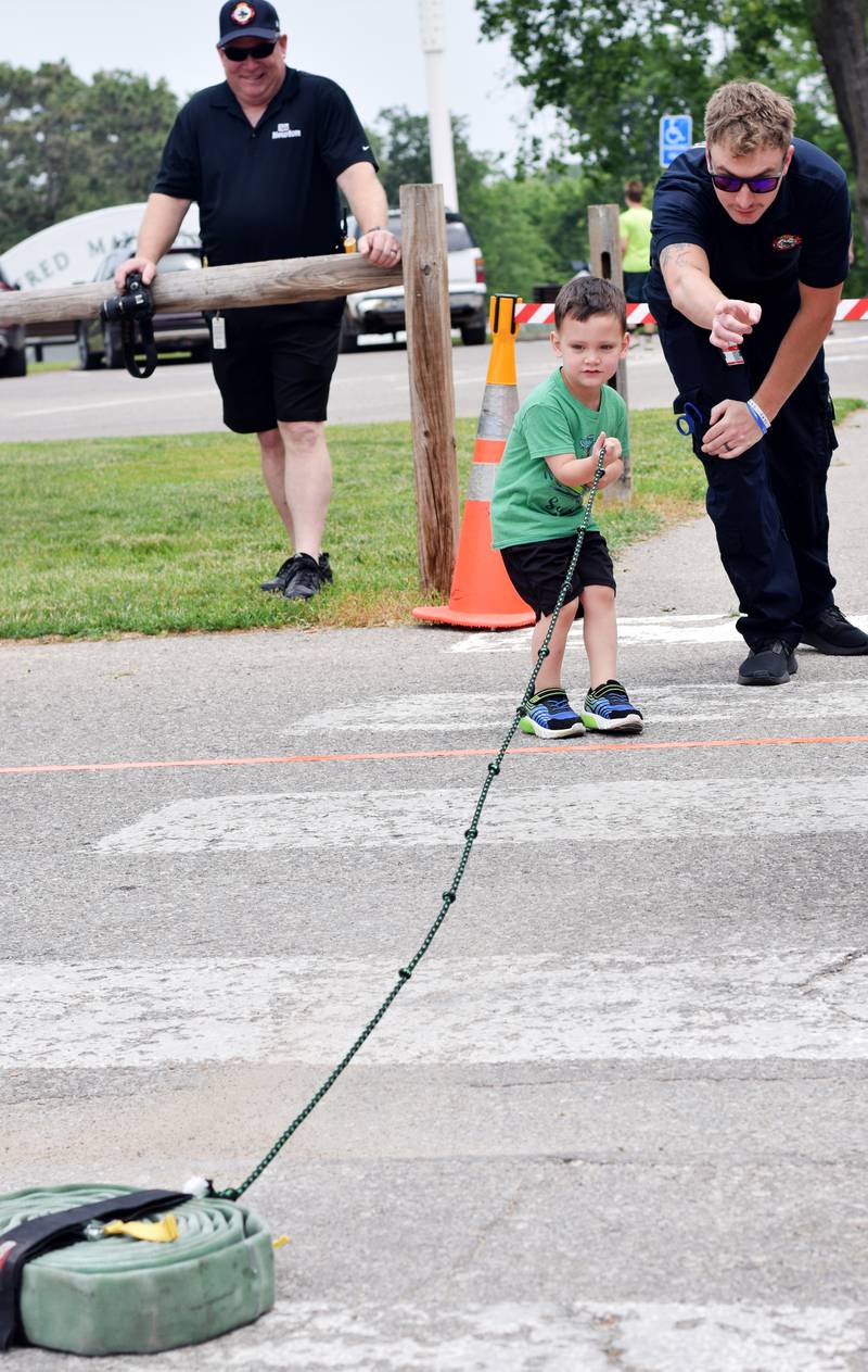 Local first responders show off emergency vehicles and have kids participate in an obstacle course as part of Safety Fest during Newton Fest on Saturday, June 10 at Maytag Park.