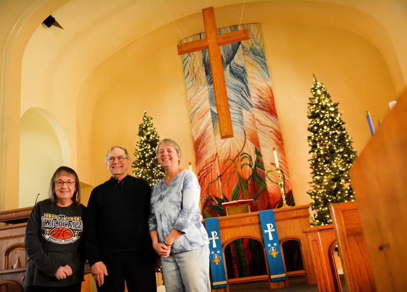 From left: Rita Baker, Pastor Kurt Hoover and Judy Monroe pose for a picture inside First Lutheran Church in Newton. Seven churches are participating in the Christmas Church Walk at 3 p.m. Dec. 14 in downtown Newton. The event was first organized in 1995 and has been revived after a 12-year hiatus.