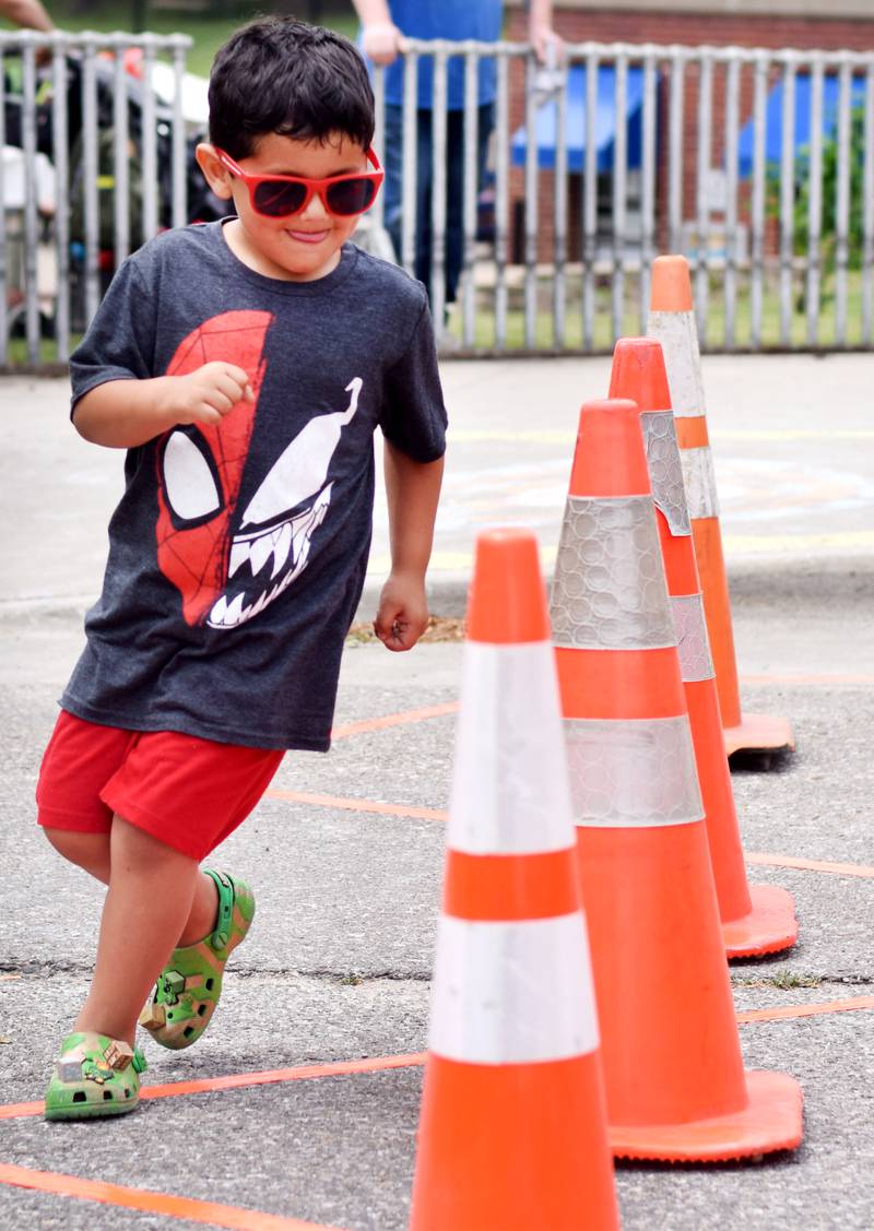 Local first responders show off emergency vehicles and have kids participate in an obstacle course as part of Safety Fest during Newton Fest on Saturday, June 10 at Maytag Park.