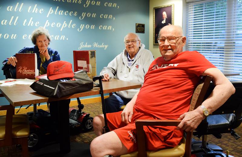 From left: Bonnie Swalwell Eilert, Gerald "Chick" Carpenter and Avery Wilson, classmates of the Newton High School Class of 1949, sit at a table together June 6 at Park Centre in Newton.