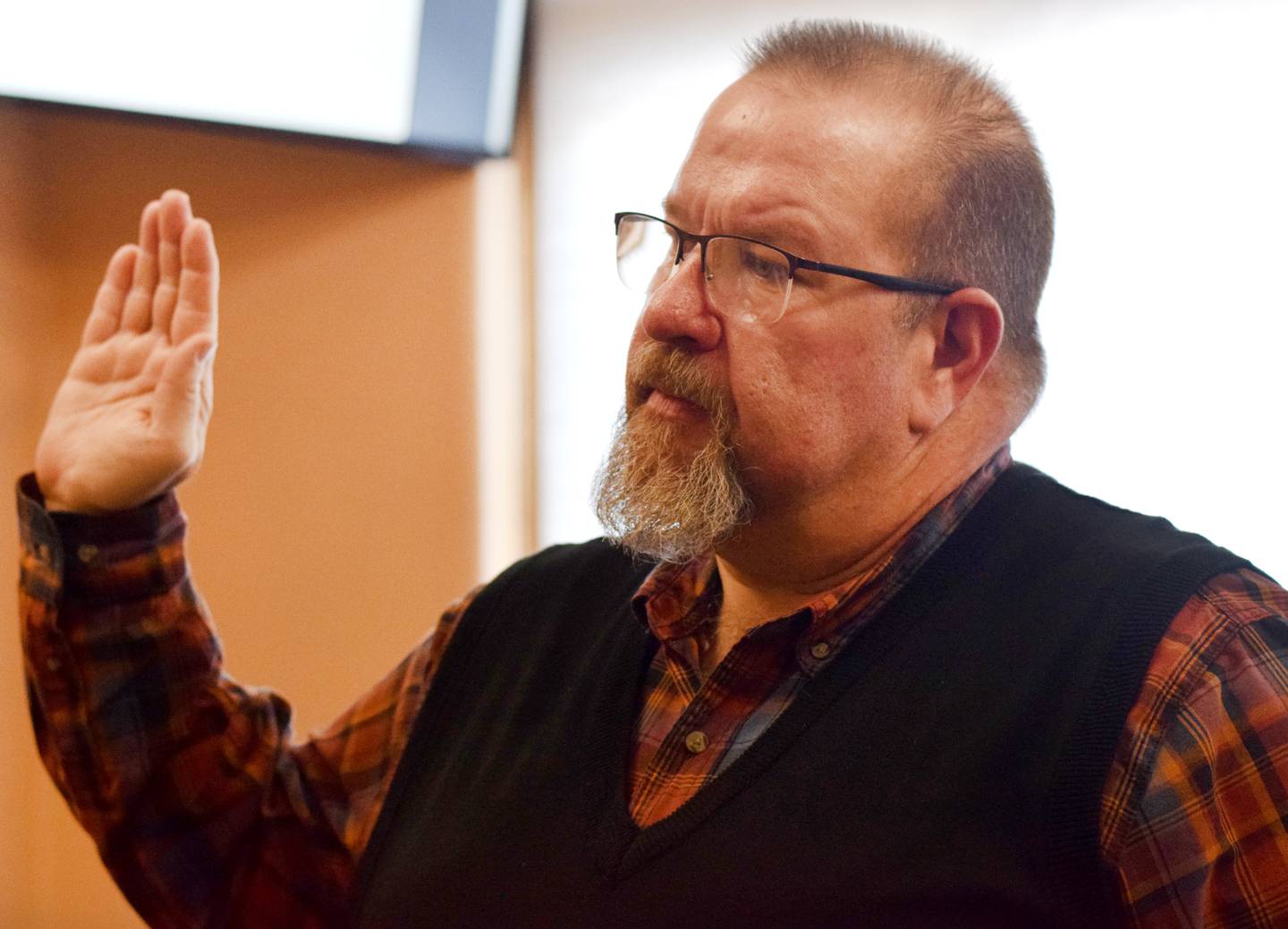 Jasper County Treasurer Doug Bishop is sworn in to office on Dec. 27 by Iowa District Court Judge Mike Jacobsen.