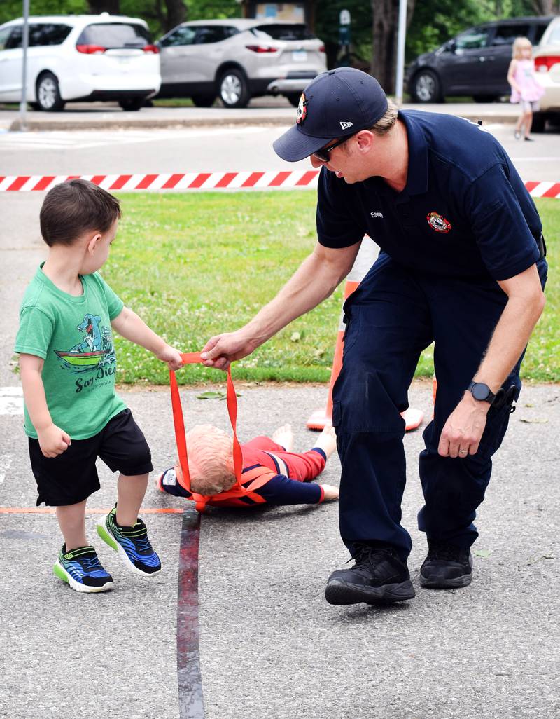 Local first responders show off emergency vehicles and have kids participate in an obstacle course as part of Safety Fest during Newton Fest on Saturday, June 10 at Maytag Park.