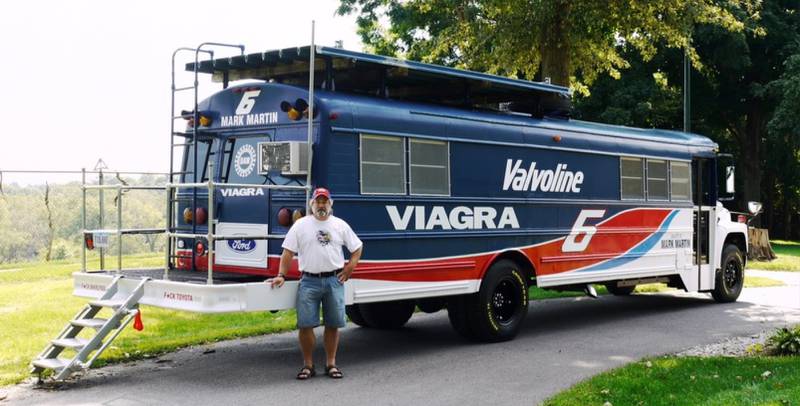 Guy Winchell, of Newton, poses next to his customized 1979 International bus, which he took with him to races from 1994 until 2013. Although he has since sold the vehicle, he still makes it to races in a camper and plans to be at the upcoming Iowa Corn 500, a NASCAR Cup Series race at Iowa Speedway.