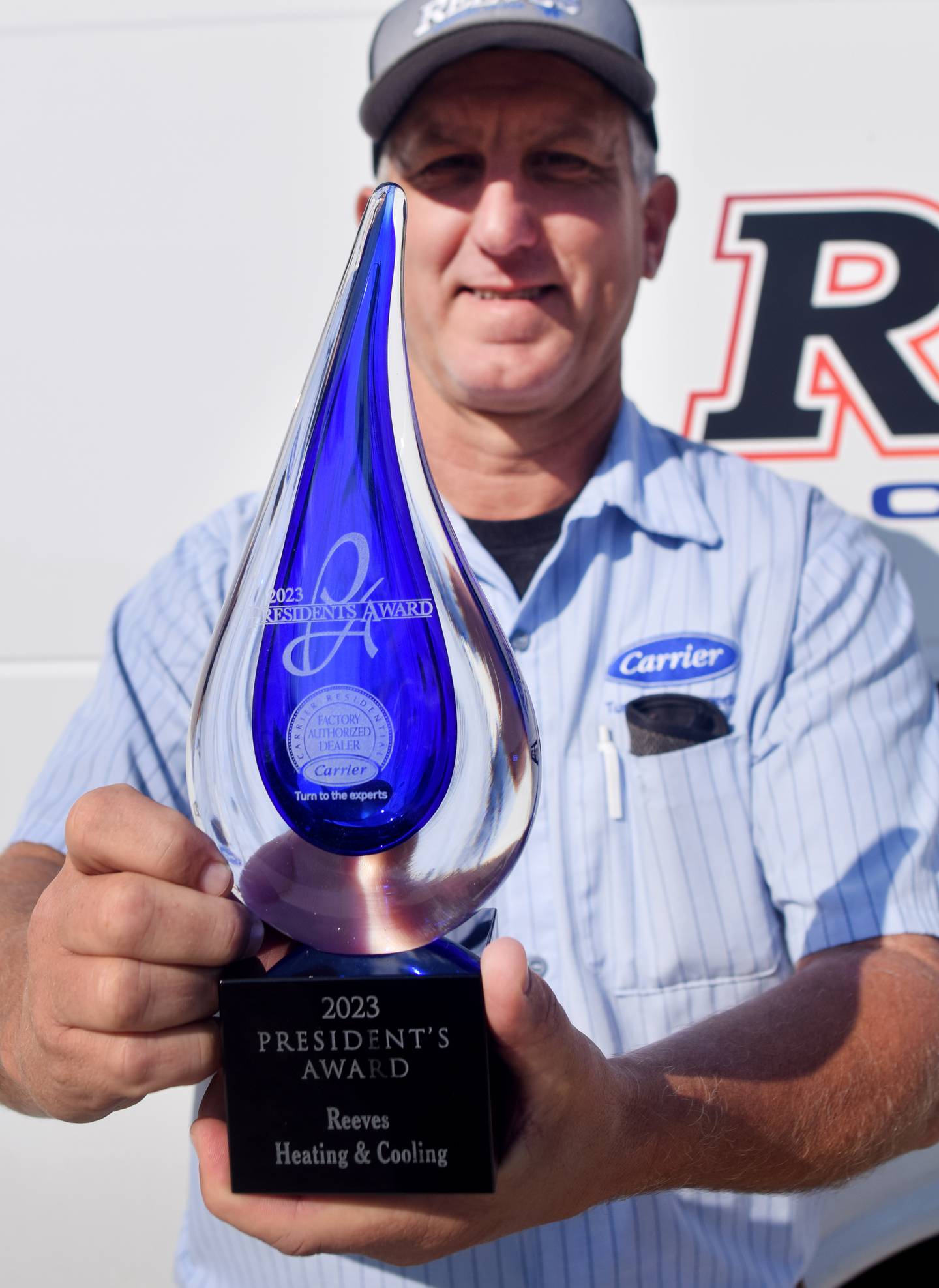 Jack Reeves, owner of Reeves Heating & Cooling, shows off the 2023 President's Award from Carrier. The award was established to recognize Carrier dealers “who exemplify exceptional leadership in business management, customer satisfaction, HVAC expertise and operational excellence.”