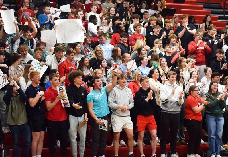 The Newton Cardinals student section cheers on their peers during The Big Game on April 19 at Newton High School.