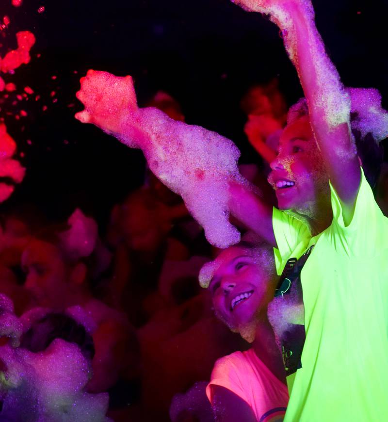 Kids enjoy the return of the Glow Foam Party – which featured two cannons this year – during Newton Fest on June 7 at Maytag Park.