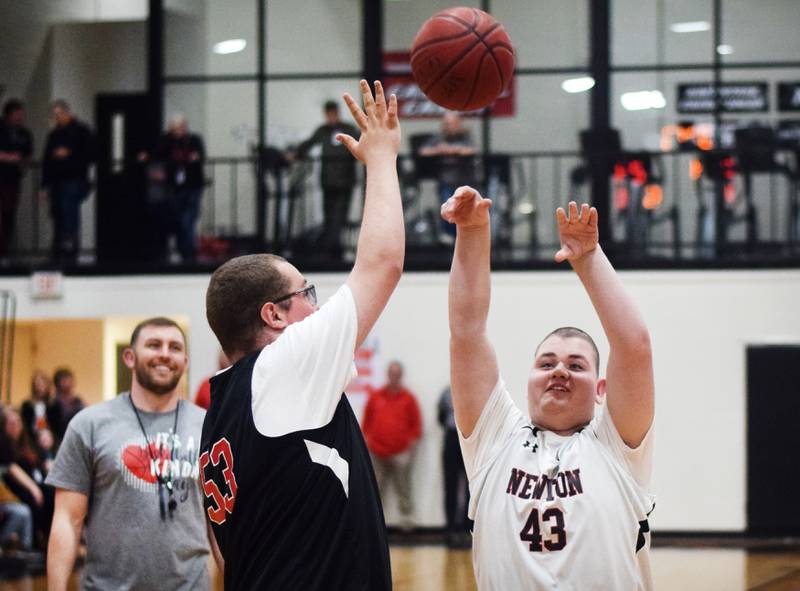 Maynard Meling shoots a two-point shot while Jaden Ferr attempts a block during The Big Game on April 19 at Newton High School.