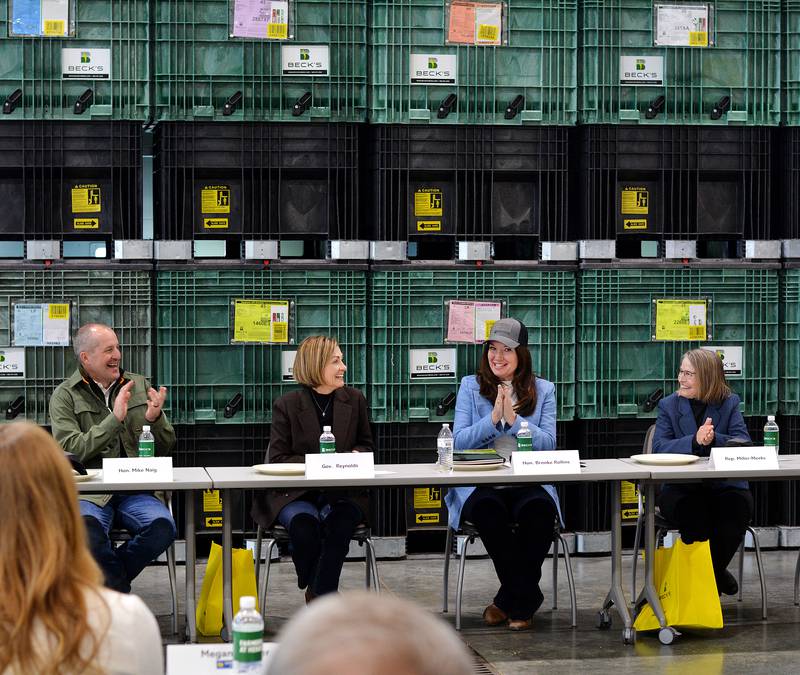 From left: Iowa Secretary of Agriculture Mike Naig, Iowa Gov. Kim Reynolds, U.S. Secretary of Agriculture Brooke Rollins and U.S. Rep. Mariannette Miler-Meeks prepare to discuss issues with Beck's Hybrids employees at a roundtable March 31 in Colfax.