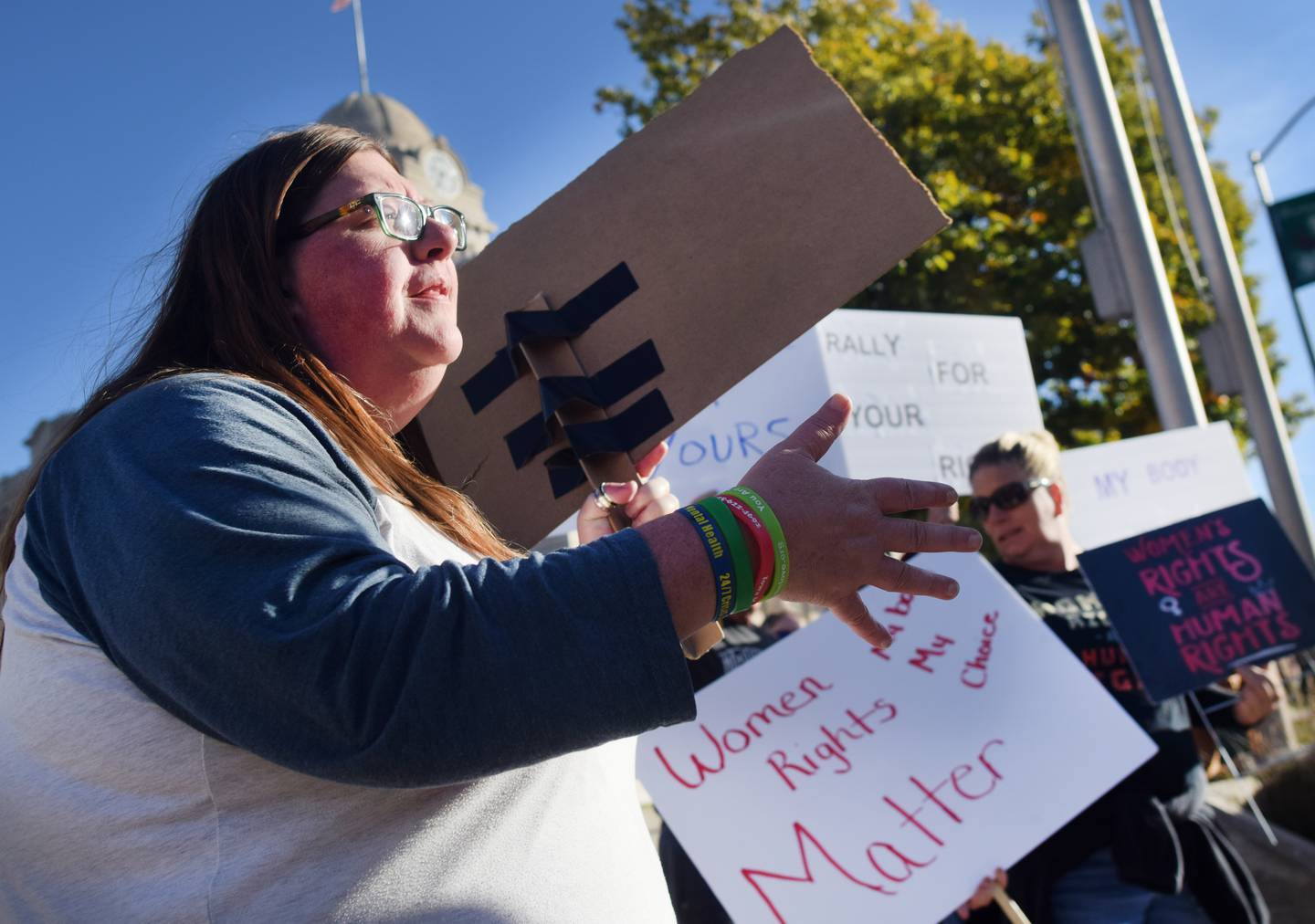 Demonstrators rallying for women's rights march around the town square on Oct. 22 in downtown Newton.