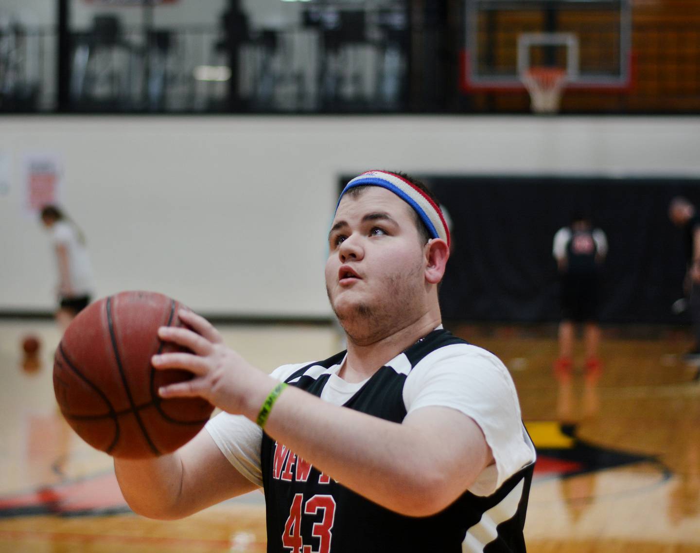 Maynard Meling prepares to make a jump shot during a practice for The Big Game inside the gymnasium at Newton High School.