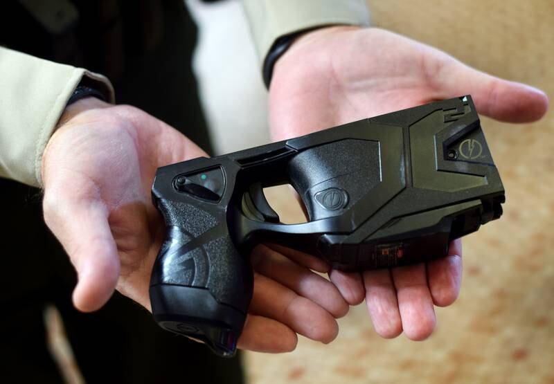 Sheriff-Elect Brad Shutts of the Jasper County Sheriff's Office shows an older model of taser that will be replaced soon by the Taser 10 by Axon Enterprise, Inc. The board of supervisors set a public hearing for a five-year contract so the department can acquire 35 new tasers.