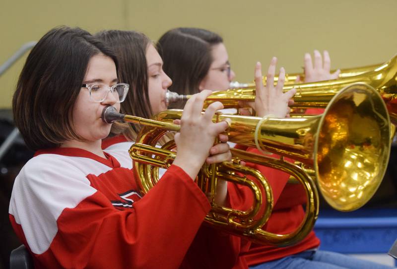 Newton alumni and students have a jam session on Dec. 16 in the band room of Newton High School. Current and past members of the Newton High School band on Dec. 16 participated in the inaugural Alumni Pep Band Night. Adam Kallal, the band director at Newton High School, organized the event in hopes it would become an annual celebration.