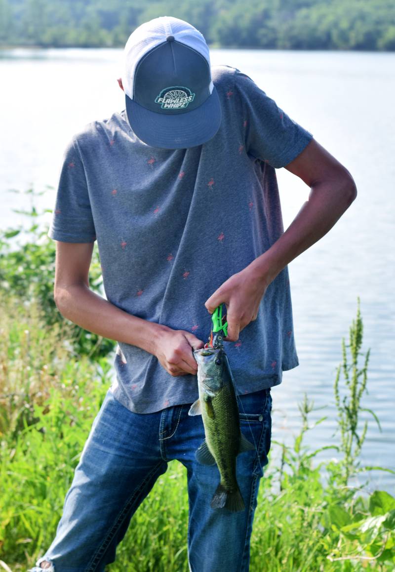 Young anglers catch bluegills and bass (and sometimes softshell turtles) during the Youth Fishing Derby on June 3 at Quarry Springs in Colfax.