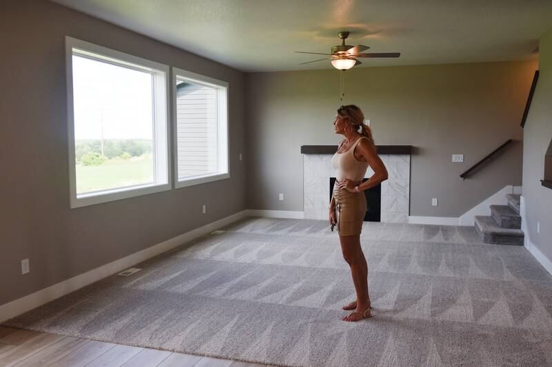 Jennifer Sullivan, of EXP Realty, showcases new homes built at Arbor Estates during an open house event July 20 in Newton.
