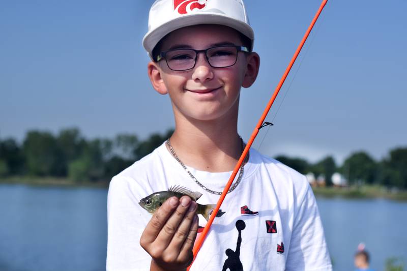 Young anglers catch bluegills and bass (and sometimes softshell turtles) during the Youth Fishing Derby on June 3 at Quarry Springs in Colfax.
