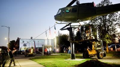 Photos: Huey helicopter monument installed in Baxter