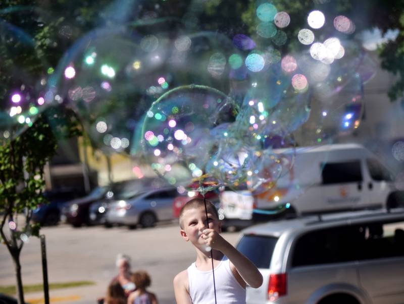 Lots of children participate in the Absolute Science Bubble Open House on June 20 at the Newton Public Library.