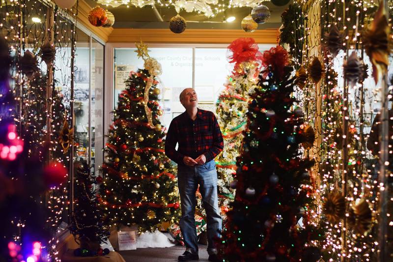 Larry Hurto gazes at the lighted trees on display at the Tree-mendous Christmas Experience at the Jasper County Historical Museum in Newton.