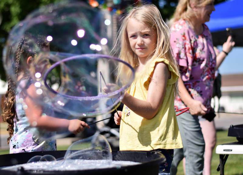 Lots of children participate in the Absolute Science Bubble Open House on June 20 at the Newton Public Library.
