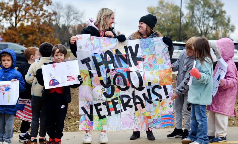 Newton Community School District students and staff participate in a Veterans Day Reverse Parade on Nov. 11, which extended to a number of school buildings in the area.