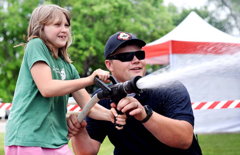 Local first responders show off emergency vehicles and have kids participate in an obstacle course as part of Safety Fest during Newton Fest on Saturday, June 10 at Maytag Park.