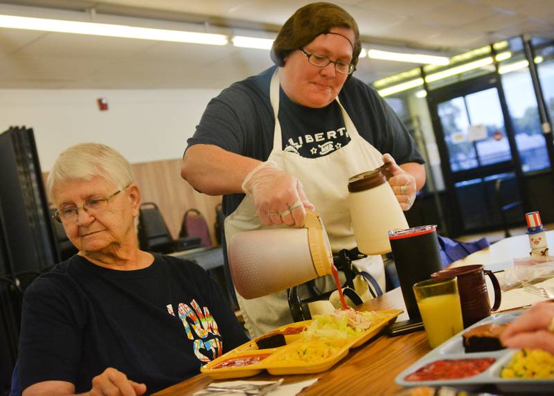 Jasper County Elderly Nutrition staff serve meals in 2018. Congregate meals in Monroe City Hall are to end in September due to a lack of attendance, but there is a chance they could be moved elsewhere in town.