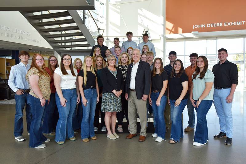 Trey Voeller of Prairie City, second row, far right, was among the students recognized as 2024-25 Mark Pearson FFA Leadership Scholars at DMACC, shown here with DMACC President Rob Denson and Eden Pearson, DMACC English Professor and wife of the late Mark Pearson, at the FFA Enrichment Center on the DMACC Ankeny Campus.