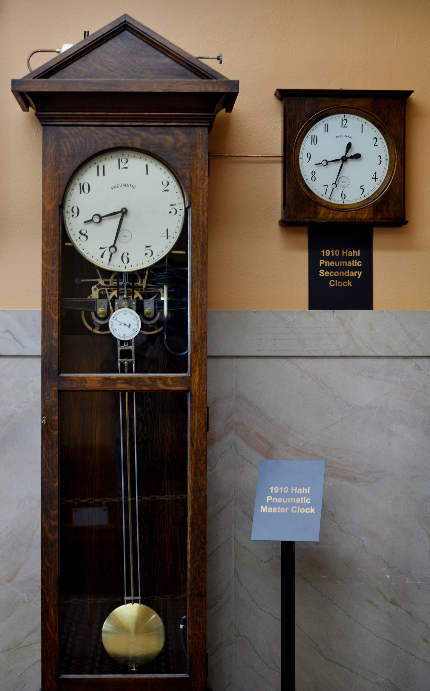The restored master clock and secondary clock are on display in the west wing of the Jasper County Courthouse.