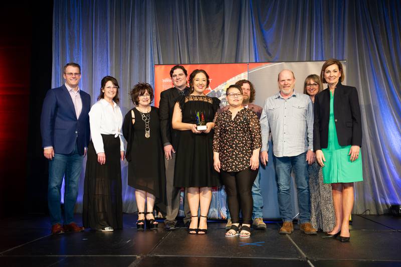 Representatives of Newton Main Street, Goldfinch Growth and Viet-Thai Taste receive an award April 22 at the Main Street Iowa Development Awards in Des Moines. Iowa Gov. Kim Reynolds and Debi Durham, executive director of Iowa Economic Development Authority and Iowa Finance Authority, presented the awards.