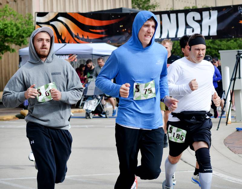 Runners participate in The Phoenix Phase Initiative's fifth annual Run For Her Life 5K and Half-Marathon on May 17 at Legacy Plaza in Newton. More than 110 people showed up for the run.