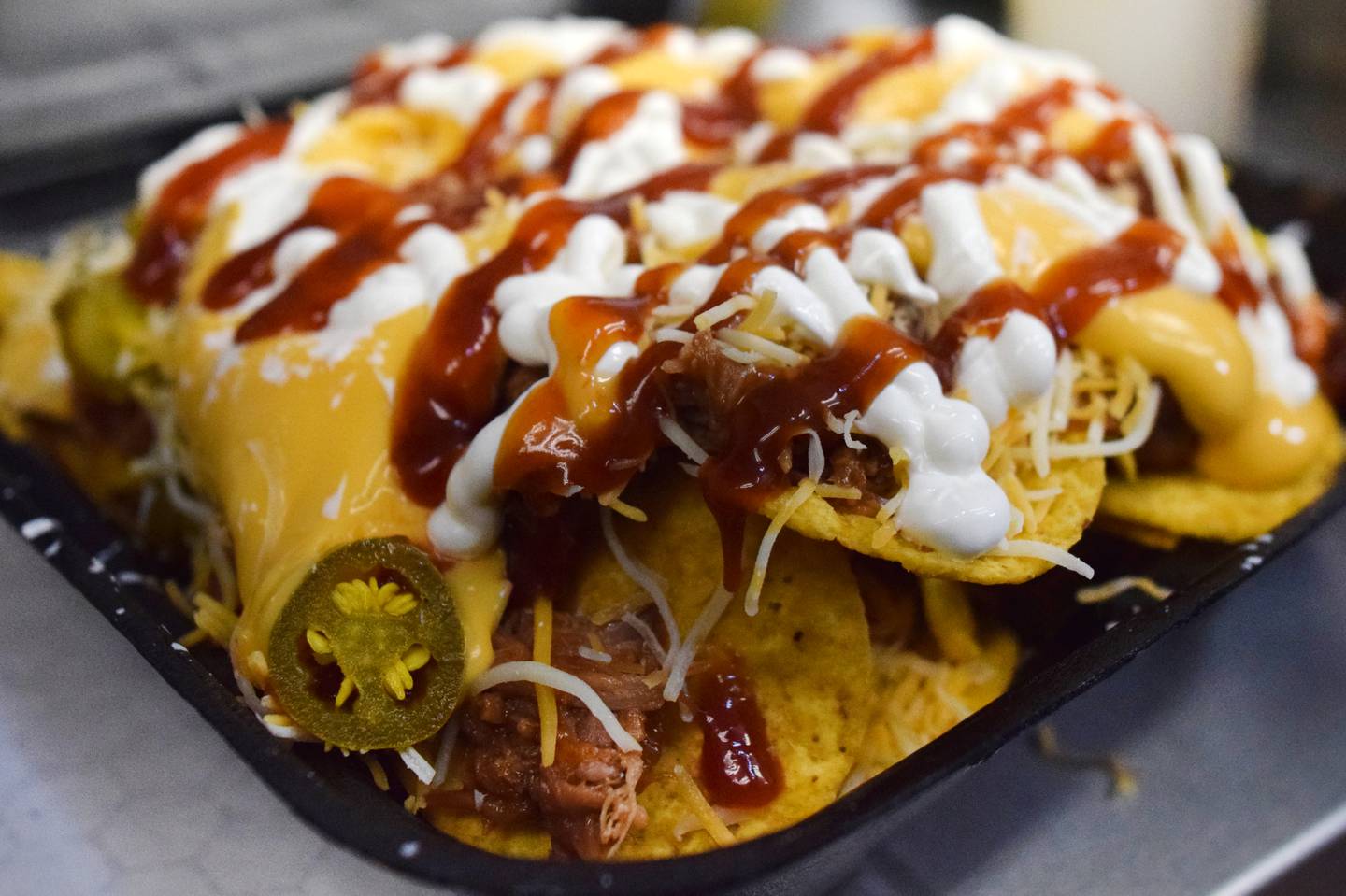 Barbecue pulled pork nachos made by Barrel Smoke BBQ & Catering during the Hy-Vee IndyCar Race Weekend's food truck challenge preview April 27 at Iowa Speedway in Newton.