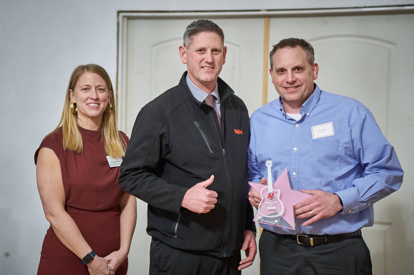 Representatives from Hy-Vee accept the Community Rock Star Award for a large business during the Greater Newton Area Chamber of Commerce's annual meeting on Jan. 26 at The Thunderdome.