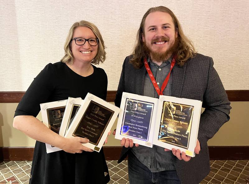 Editor Jamee A. Pierson and associate editor Christopher Braunschweig at the Iowa Newspaper Association contest awards banquet with the many first place finishes the newspapers received.