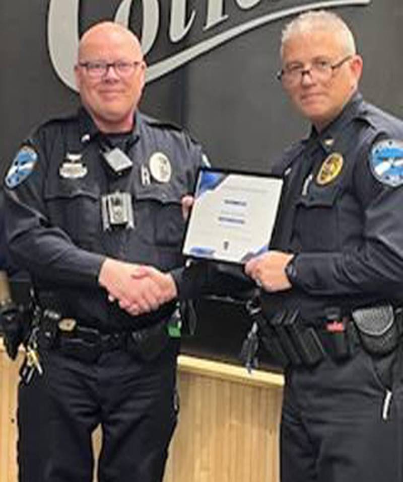 Colfax Reserve Officer of the Year Shawn McCauley with police chief Rob Burdess.