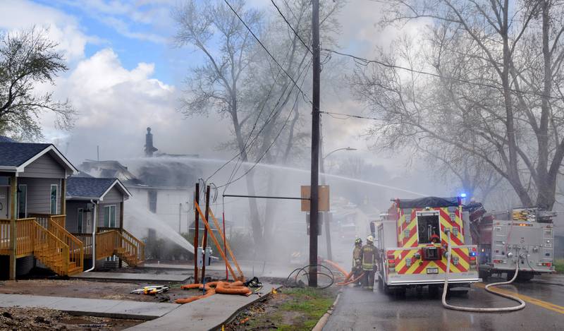 Firefighters from multiple agencies in Jasper and Polk Counties respond to a house fire on Thursday, April 20, near the 300 block of South Walnut Street in Colfax.