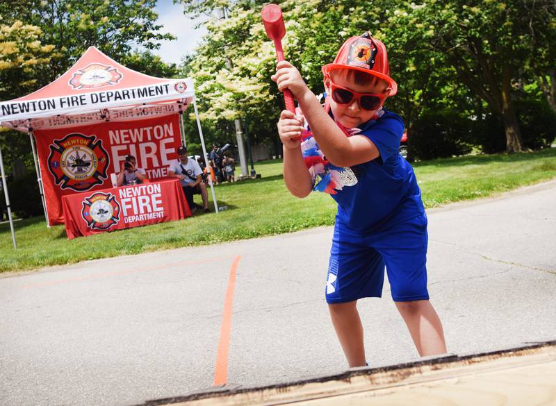 Kids participate in obstacle courses and take a try at the fire hose during Safety Fest on June 8 in Maytag Park. Safety Fest is regularly organized by the Newton Fire Department.
