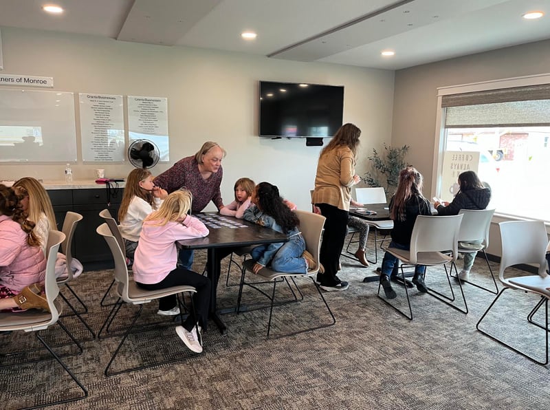 Adults took the time to play games and read stories to second grade students during their visit to The Gathering Place of Monroe.