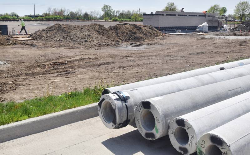 Edge Commercial contractors work on the home team dugout and backstop of the new Newton baseball stadium on May 10. School officials are hopeful the stadium can be finished before July.