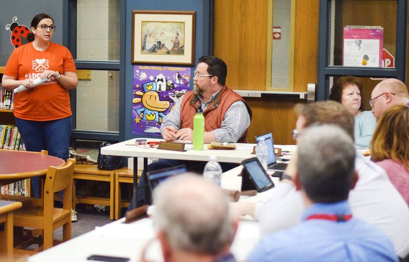 Jenna Isely, a mental health therapist intern at Capstone Behavioral Healthcare, speaks to Newton school board members on Feb. 27 at Thomas Jefferson Elementary School about a new partnership that would provide school-based therapy to elementary students.