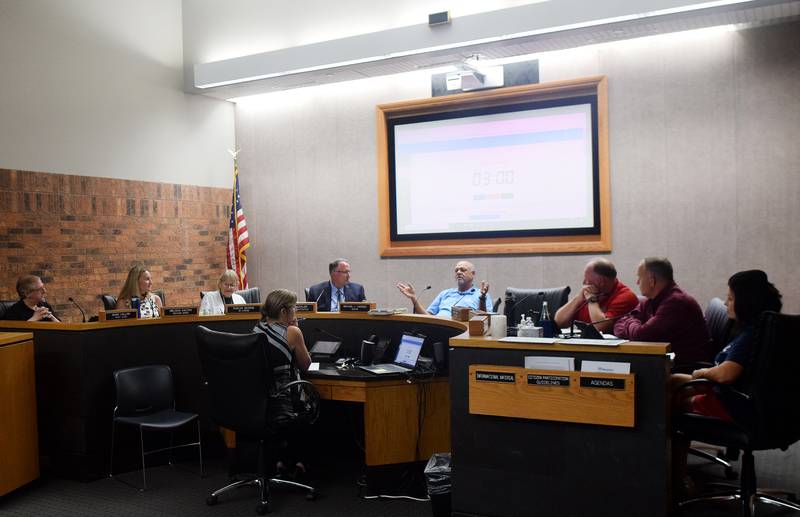 The Newton City Council and mayor discuss the details of a new commercial inspection program during the Aug. 21 work session at city hall.