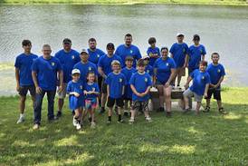 Young anglers and their police partners hook big fish at Cops and Bobbers