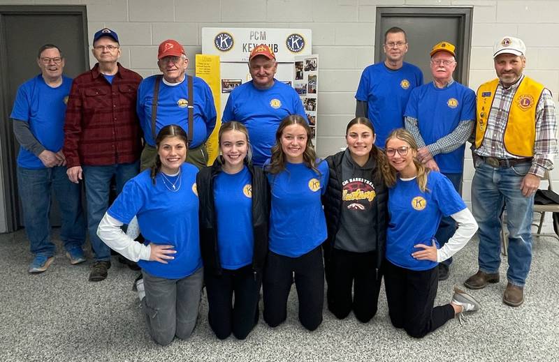Lions Club President Greg Townley presents a $238.62 check to PCM Key Club representatives.