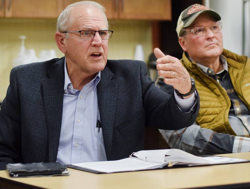 Sen. Ken Rozenboom and Rep. Jon Dunwell speak with constituents during a legislative gathering hosted by the League of Women Voters of Jasper County on Jan. 21 at the Hy-Vee in Newton. Several people attended the meeting to voice their displeasure with the school choice bill, which passed earlier this week and was signed into law on Jan. 24.